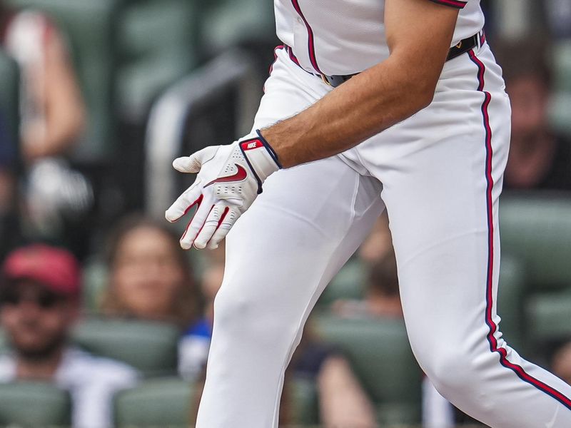 Jul 4, 2024; Cumberland, Georgia, USA; Atlanta Braves first baseman Matt Olson (28) hits a single against the San Francisco Giants during the first inning at Truist Park. Mandatory Credit: Dale Zanine-USA TODAY Sports