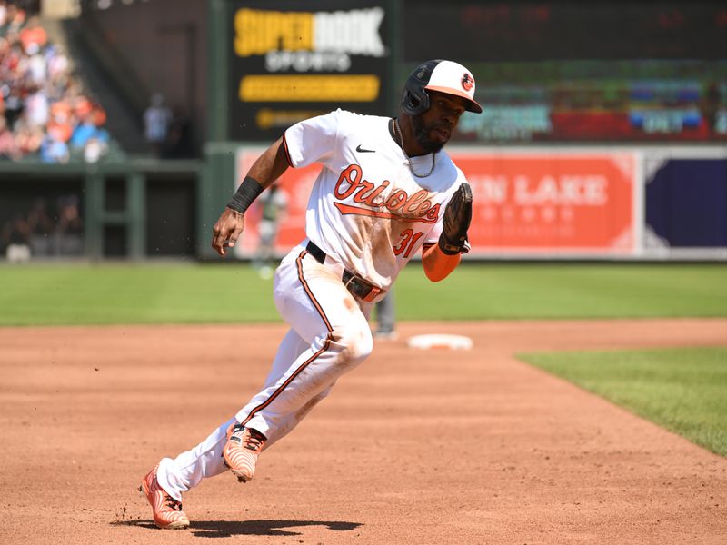 Apr 28, 2024; Baltimore, Maryland, USA;  Baltimore Orioles center fielder Cedric Mullins (31) rounds the bases during the second inning against the Oakland Athletics at Oriole Park at Camden Yards. Mandatory Credit: James A. Pittman-USA TODAY Sports