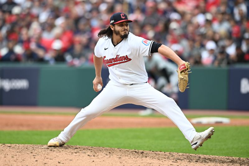 Oct 12, 2024; Cleveland, Ohio, USA; Cleveland Guardians pitcher Eli Morgan (49) pitches in the seventh inning against the Detroit Tigers  during game five of the ALDS for the 2024 MLB Playoffs at Progressive Field. Mandatory Credit: Ken Blaze-Imagn Images