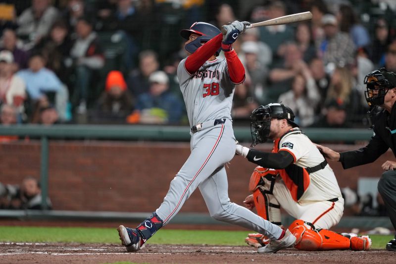 Apr 9, 2024; San Francisco, California, USA; Washington Nationals third baseman Trey Lipscomb (38) hits an RBI sacrifice fly against the San Francisco Giants during the seventh inning at Oracle Park. Mandatory Credit: Darren Yamashita-USA TODAY Sports