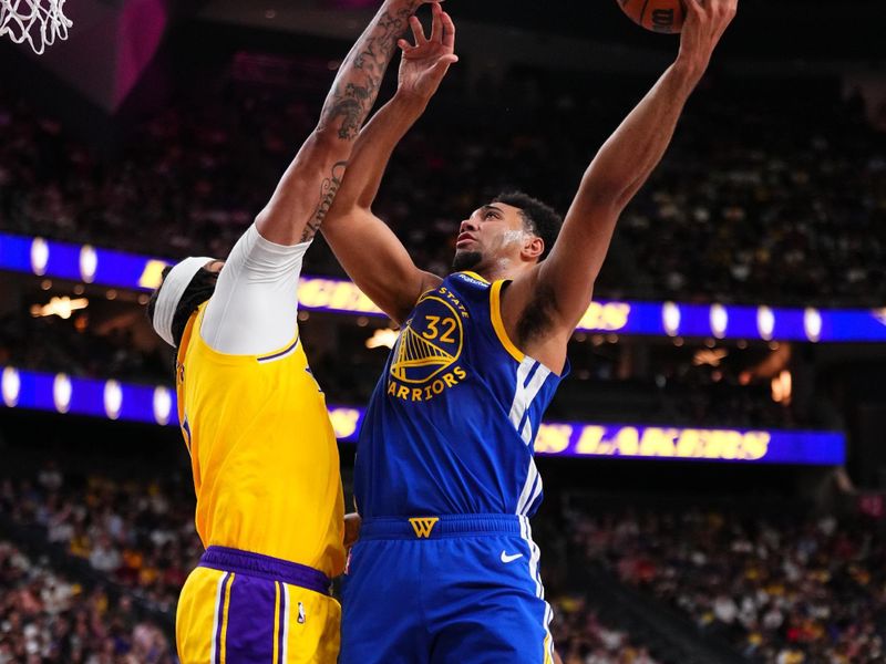 LAS VEGAS, NV - OCTOBER 15: Trayce Jackson-Davis #32 of the Golden State Warriors drives to the basket during the game against the Los Angeles Lakers during the 2024 NBA Preseason on October 15, 2024 at T-Mobile Arena in Las Vegas, Nevada. NOTE TO USER: User expressly acknowledges and agrees that, by downloading and or using this photograph, User is consenting to the terms and conditions of the Getty Images License Agreement. Mandatory Copyright Notice: Copyright 2024 NBAE  (Photo by Jeff Bottari/NBAE via Getty Images)