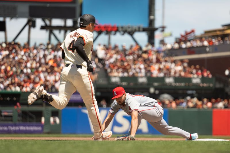 Jun 16, 2024; San Francisco, California, USA;  Los Angeles Angels first base Nolan Schanuel (18) misses the ball during the fourth inning against San Francisco Giants first base Wilmer Flores (41) at Oracle Park. Mandatory Credit: Stan Szeto-USA TODAY Sports