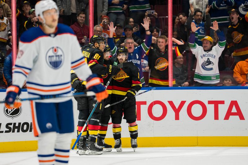 Nov 6, 2023; Vancouver, British Columbia, CAN; Vancouver Canucks defenseman Filip Hronek (17) and forward Pius Suter (24) and forward Conor Garland (8) and forward Dakota Joshua (81) celebrate Suter s goal against the Edmonton Oilers in the first period at Rogers Arena. Mandatory Credit: Bob Frid-USA TODAY Sports