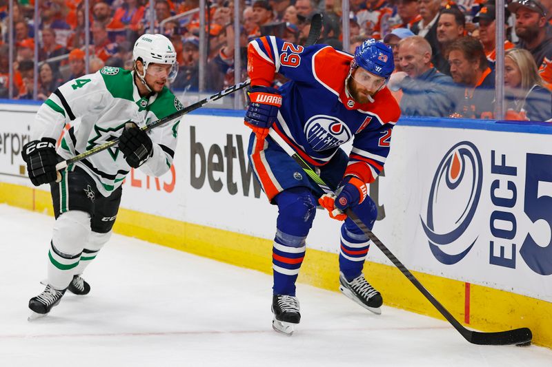 Jun 2, 2024; Edmonton, Alberta, CAN; Edmonton Oilers forward Leon Draisaitl (29) protects the puck from Dallas Stars defensemen Miro Heiskanen (4) during the first period in game six of the Western Conference Final of the 2024 Stanley Cup Playoffs at Rogers Place. Mandatory Credit: Perry Nelson-USA TODAY Sports