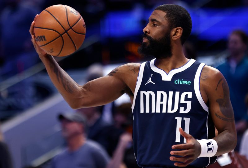 DALLAS, TX - MARCH 17: Kyrie Irving #11 of the Dallas Mavericks handles the ball before playing against the Denver Nuggets at American Airlines Center on March 17, 2024 in Dallas, Texas. NOTE TO USER: User expressly acknowledges and agrees that, by downloading and or using this photograph, User is consenting to the terms and conditions of the Getty Images License Agreement. (Photo by Ron Jenkins/Getty Images)