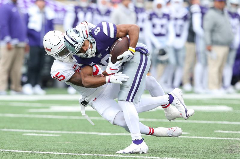 Oct 28, 2023; Manhattan, Kansas, USA; Kansas State Wildcats wide receiver Phillip Brooks (8) is tackled by Houston Cougars defensive back Malik Fleming (15) during the second quarter at Bill Snyder Family Football Stadium. Mandatory Credit: Scott Sewell-USA TODAY Sports