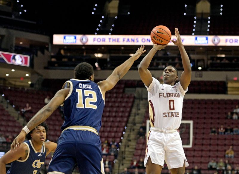 Jan 3, 2024; Tallahassee, Florida, USA; Florida State Seminoles guard Chandler Jackson (0) shoots the ball over Georgia Tech Yellow Jackets guard Tyzhaun Claude (12) during the first half at Donald L. Tucker Center. Mandatory Credit: Melina Myers-USA TODAY Sports