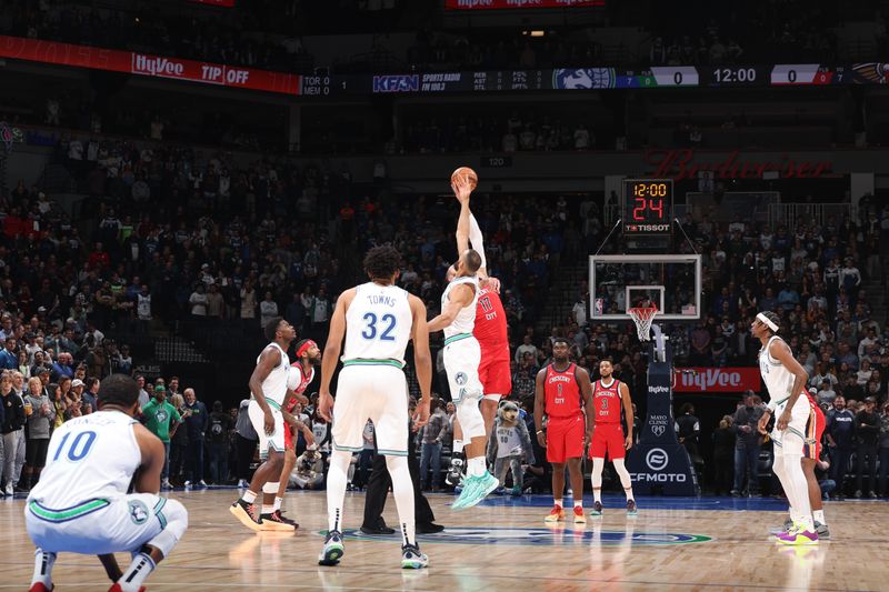 MINNEAPOLIS, MN -  JANUARY 3: Karl-Anthony Towns #32 of the Minnesota Timberwolves and Jonas Valanciunas #17 of the New Orleans Pelicans go up for the opening tip off on January 3, 2024 at Target Center in Minneapolis, Minnesota. NOTE TO USER: User expressly acknowledges and agrees that, by downloading and or using this Photograph, user is consenting to the terms and conditions of the Getty Images License Agreement. Mandatory Copyright Notice: Copyright 2024 NBAE (Photo by David Sherman/NBAE via Getty Images)