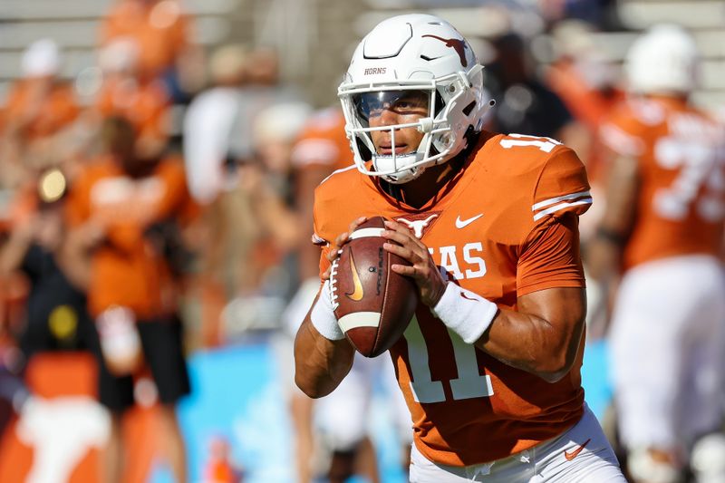 Oct 9, 2021; Dallas, Texas, USA; Texas Longhorns quarterback Casey Thompson (11) warms up before the game against the Oklahoma Sooners at the Cotton Bowl. Mandatory Credit: Kevin Jairaj-USA TODAY Sports