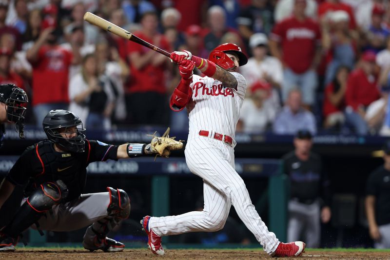 Oct 4, 2023; Philadelphia, Pennsylvania, USA; Philadelphia Phillies second baseman Bryson Stott (5) hits a grand slam against the Miami Marlins during the sixth inning for game two of the Wildcard series for the 2023 MLB playoffs at Citizens Bank Park. Mandatory Credit: Bill Streicher-USA TODAY Sports