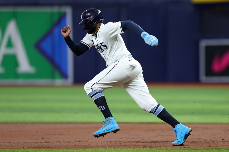 Sep 2, 2024; St. Petersburg, Florida, USA; Tampa Bay Rays third baseman Junior Caminero (13) runs to second base against the Los Minnesota Twins in the first inning at Tropicana Field. Mandatory Credit: Nathan Ray Seebeck-USA TODAY Sports