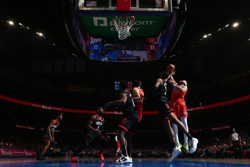 OKLAHOMA CITY, OK - MARCH 27:  Kenrich Williams #34 of the Oklahoma City Thunder grabs a rebound during the game against the Houston Rockets on March 27, 2024 at Paycom Arena in Oklahoma City, Oklahoma. NOTE TO USER: User expressly acknowledges and agrees that, by downloading and or using this photograph, User is consenting to the terms and conditions of the Getty Images License Agreement. Mandatory Copyright Notice: Copyright 2024 NBAE (Photo by Zach Beeker/NBAE via Getty Images)