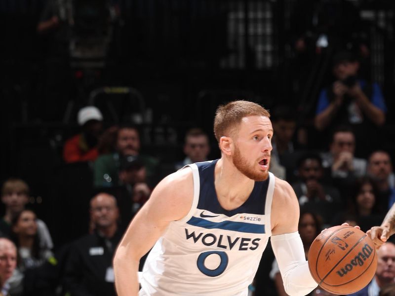 MINNEAPOLIS, MN -  OCTOBER 29: Donte DiVincenzo #0 of the Minnesota Timberwolves dribbles the ball during the game against the Dallas Mavericks on October 29, 2024 at Target Center in Minneapolis, Minnesota. NOTE TO USER: User expressly acknowledges and agrees that, by downloading and or using this Photograph, user is consenting to the terms and conditions of the Getty Images License Agreement. Mandatory Copyright Notice: Copyright 2024 NBAE (Photo by David Sherman/NBAE via Getty Images)