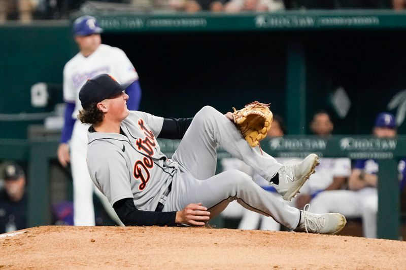 Jun 29, 2023; Arlington, Texas, USA; Detroit Tigers starting pitcher Reese Olson (45) grabs his left leg after being hit by a batted ball by Texas Rangers shortstop Josh Smith (not pictured) during the second inning at Globe Life Field. Mandatory Credit: Raymond Carlin III-USA TODAY Sports