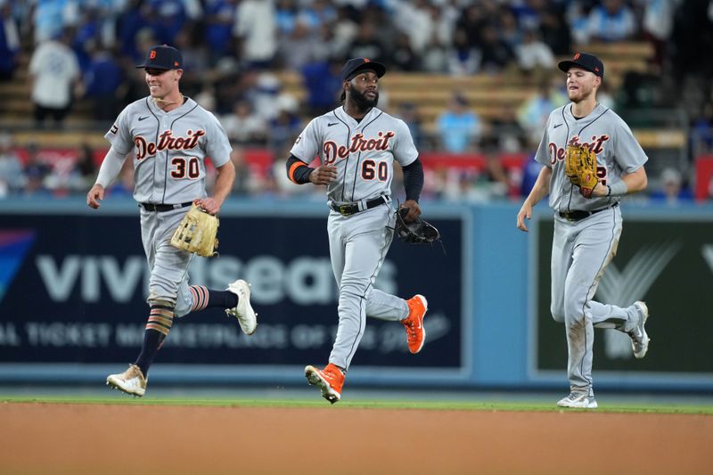 Sep 20, 2023; Los Angeles, California, USA; Detroit Tigers right fielder Kerry Carpenter (30), left fielder Akil Baddoo (60) and center fielder Parker Meadows (22) react at the end of the game against the Los Angeles Dodgers at Dodger Stadium. Mandatory Credit: Kirby Lee-USA TODAY Sports