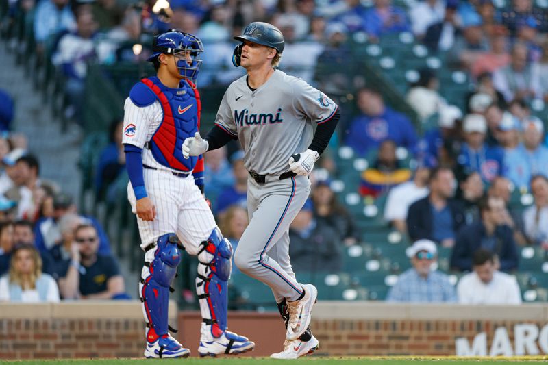 May 14, 2025; Chicago, Illinois, USA; Miami Marlins center fielder Kyle Stowers (28) crosses home plate after hitting a solo home run against the Chicago Cubs during the second inning at Wrigley Field. Mandatory Credit: Kamil Krzaczynski-Imagn Images