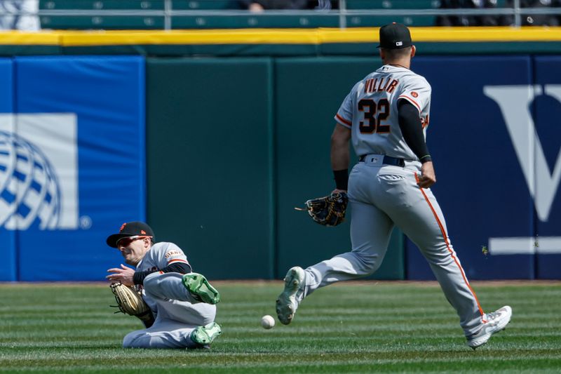 Apr 6, 2023; Chicago, Illinois, USA; San Francisco Giants center fielder Mike Yastrzemski (5) is unable to catch a fly ball hit by Chicago White Sox shortstop Hanser Alberto (not pictured) during the third inning at Guaranteed Rate Field. Mandatory Credit: Kamil Krzaczynski-USA TODAY Sports