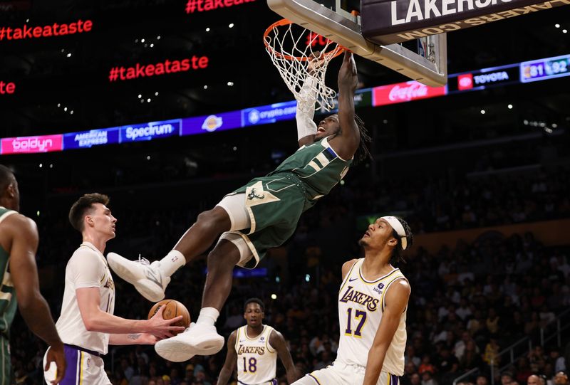 LOS ANGELES, CALIFORNIA - OCTOBER 15: Chris Livingston #7 of the Milwaukee Bucks scores a basket against Alex Fudge #17 of the Los Angeles Lakers during the second half of a preseason basketball game at Crypto.com Arena on October 15, 2023 in Los Angeles, California. NOTE TO USER: User expressly acknowledges and agrees that, by downloading and or using this photograph, User is consenting to the terms and conditions of the Getty Images License Agreement. (Photo by Kevork Djansezian/Getty Images)