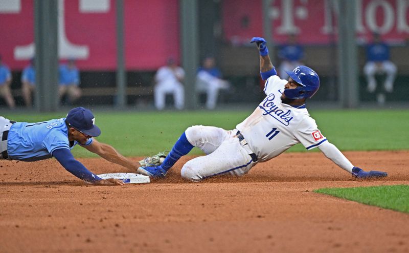 Jul 2, 2024; Kansas City, Missouri, USA; Kansas City Royals second baseman Maikel Garcia (11) slides into second base before the tag from Tampa Bay Rays second baseman Richie Palacios (1) in the first inning at Kauffman Stadium. Mandatory Credit: Peter Aiken-USA TODAY Sports