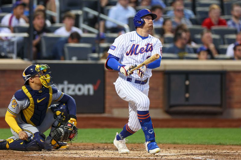 Jun 27, 2023; New York City, New York, USA; New York Mets center fielder Brandon Nimmo (9) hits a solo home run during the fourth inning in front Milwaukee Brewers catcher William Contreras (24) at Citi Field. Mandatory Credit: Vincent Carchietta-USA TODAY Sports