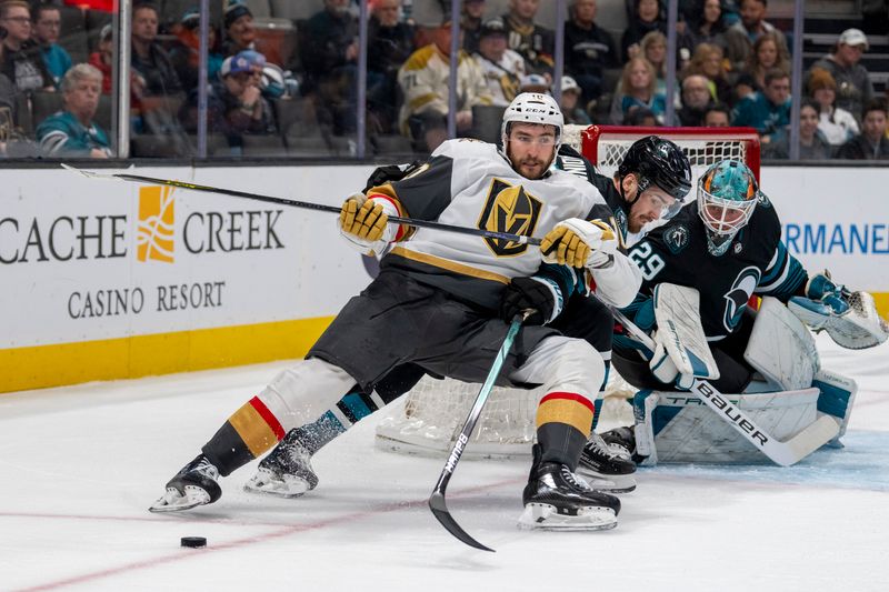 Feb 19, 2024; San Jose, California, USA; San Jose Sharks right wing Filip Zadina (18) and Vegas Golden Knights left wing Pavel Dorofeyev (16) battle for the puck during the first period at SAP Center at San Jose. Mandatory Credit: Neville E. Guard-USA TODAY Sports