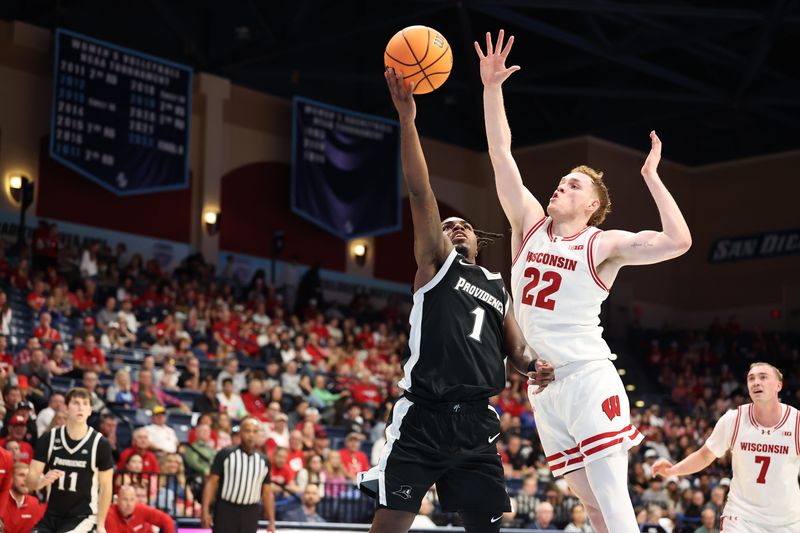Nov 27, 2025; San Diego, CA, USA; Providence Friars guard Jason Edwards (1) shoots the ball against Wisconsin Badgers forward Austin Rapp (22) during the first half at Jenny Craig Pavilion. Mandatory Credit: Abe Arredondo-Imagn Images