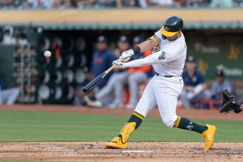 Jul 23, 2024; Oakland, California, USA;  Oakland Athletics outfielder Seth Brown (15) hits a solo home run during the fourth inning against the Houston Astros at Oakland-Alameda County Coliseum. Mandatory Credit: Stan Szeto-USA TODAY Sports