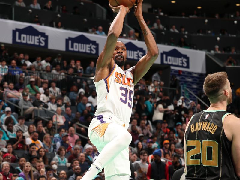 CHARLOTTE, NC - MARCH 1:  Kevin Durant #35 of the Phoenix Suns shoots the ball against the Charlotte Hornets on March 1, 2023 at Spectrum Center in Charlotte, North Carolina. NOTE TO USER: User expressly acknowledges and agrees that, by downloading and or using this photograph, User is consenting to the terms and conditions of the Getty Images License Agreement. Mandatory Copyright Notice: Copyright 2023 NBAE (Photo by Kent Smith/NBAE via Getty Images)