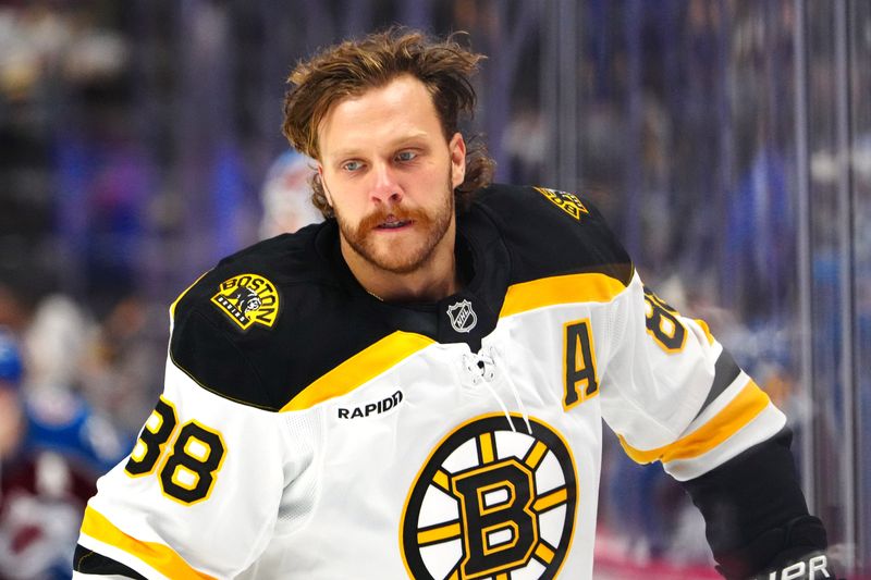 Oct 16, 2024; Denver, Colorado, USA; Boston Bruins right wing David Pastrnak (88) before the game against the Colorado Avalanche at Ball Arena. Mandatory Credit: Ron Chenoy-Imagn Images