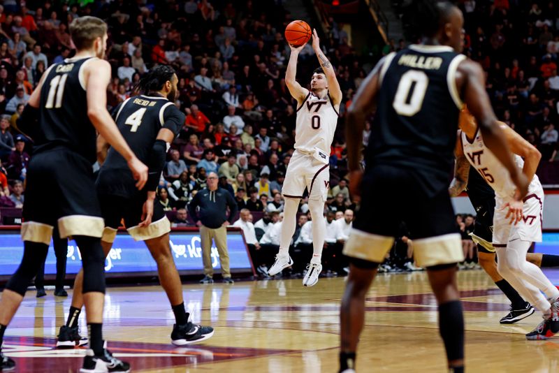 Mar 2, 2024; Blacksburg, Virginia, USA; Virginia Tech Hokies guard Hunter Cattoor (0) shoots the ball against Wake Forest Demon Deacons forward Efton Reid III (4) during the second half at Cassell Coliseum. Mandatory Credit: Peter Casey-USA TODAY Sports