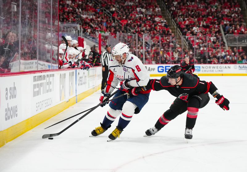 May 10, 2025; Raleigh, North Carolina, USA; Washington Capitals left wing Alex Ovechkin (8) skates with the puck outside of Carolina Hurricanes defenseman Dmitry Orlov (7) during the second period in game three of the second round of the 2025 Stanley Cup Playoffs at Lenovo Center. Mandatory Credit: James Guillory-Imagn Images