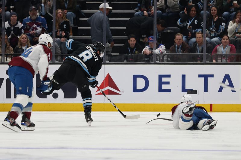 Feb 25, 2026; Salt Lake City, Utah, USA; Utah Mammoth center Nick Schmaltz (8) takes a shot against the diving Colorado Avalanche defenseman Josh Manson (42) during the second period at Delta Center. Mandatory Credit: Rob Gray-Imagn Images