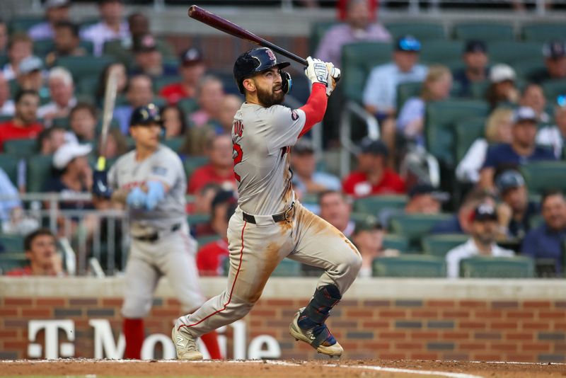 May 8, 2024; Atlanta, Georgia, USA; Boston Red Sox catcher Connor Wong (12) hits a single against the Atlanta Braves in the third inning at Truist Park. Mandatory Credit: Brett Davis-USA TODAY Sports