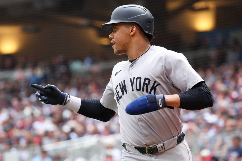 May 16, 2024; Minneapolis, Minnesota, USA; New York Yankees Juan Soto (22) celebrates after scoring on a sacrifice fly hit by Alex Verdugo (24) during the seventh inning against the Minnesota Twins at Target Field. Mandatory Credit: Matt Krohn-USA TODAY Sports