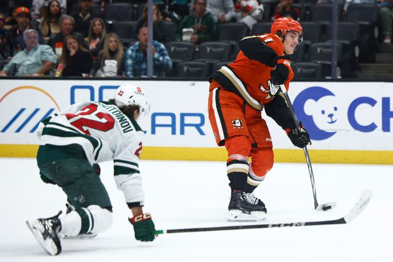 Nov 8, 2024; Anaheim, California, USA; Anaheim Ducks center Leo Carlsson (91) shoots during the second period against the Minnesota Wild at Honda Center. Mandatory Credit: Jessica Alcheh-Imagn Images