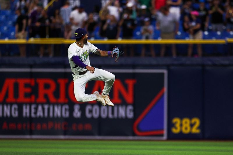 Jul 12, 2024; St. Petersburg, Florida, USA; Tampa Bay Rays outfielder Jose Siri (22) celebrates after beating the Cleveland Guardians at Tropicana Field. Mandatory Credit: Nathan Ray Seebeck-USA TODAY Sports