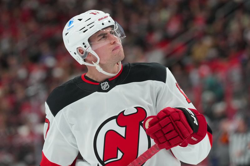 Oct 9, 2025; Raleigh, North Carolina, USA;  New Jersey Devils defenseman Simon Nemec (17) looks up during the game against the Carolina Hurricanes during the second period at Lenovo Center. Mandatory Credit: James Guillory-Imagn Images