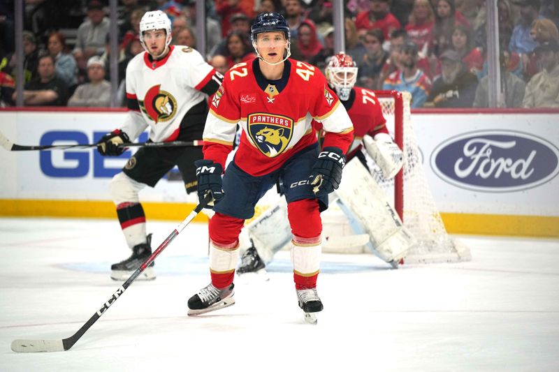 Feb 20, 2024; Sunrise, Florida, USA; Florida Panthers defenseman Gustav Forsling (42) defends in the Florida zone against the Ottawa Senators at Amerant Bank Arena. Mandatory Credit: Jim Rassol-USA TODAY Sports