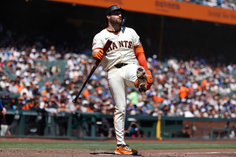 Aug 28, 2025; San Francisco, California, USA; San Francisco Giants second baseman Casey Schmitt (10) reacts after striking out during the fifth inning against the Chicago Cubs at Oracle Park. Mandatory Credit: Sergio Estrada-Imagn Images