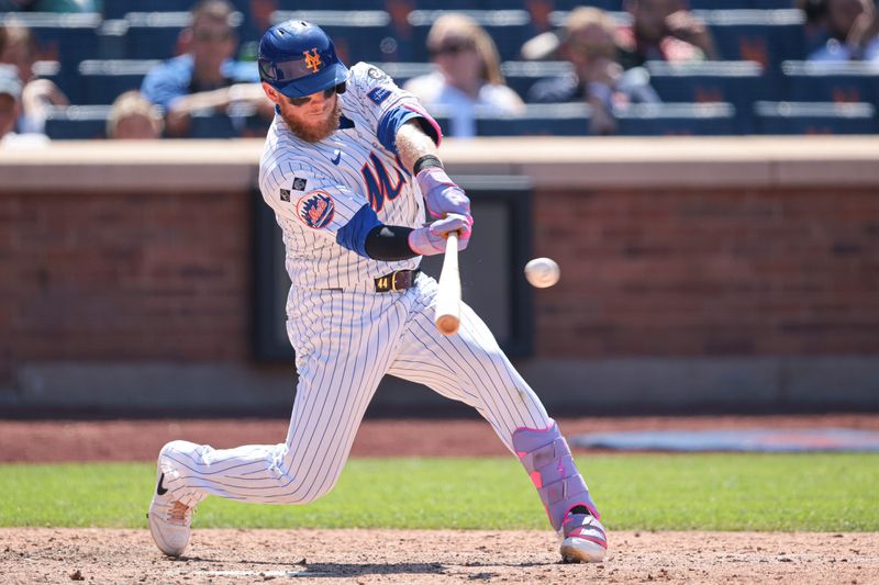 Jul 11, 2024; New York City, New York, USA; New York Mets center fielder Harrison Bader (44) hits a two RBI single during the eighth inning against the Washington Nationals at Citi Field. Mandatory Credit: Vincent Carchietta-USA TODAY Sports