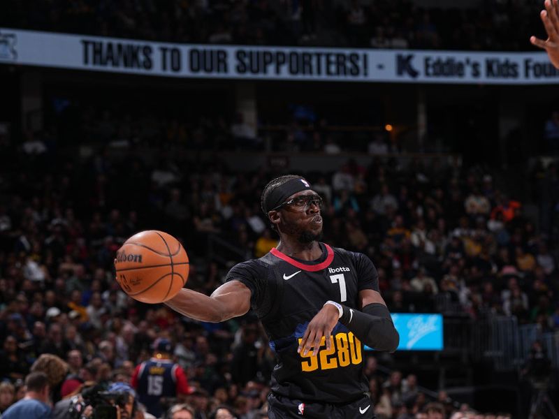 DENVER, CO - FEBRUARY 29: Reggie Jackson #7 of the Denver Nuggets passes the ball during the game against the Miami Heat on February 29, 2024 at the Ball Arena in Denver, Colorado. NOTE TO USER: User expressly acknowledges and agrees that, by downloading and/or using this Photograph, user is consenting to the terms and conditions of the Getty Images License Agreement. Mandatory Copyright Notice: Copyright 2024 NBAE (Photo by Bart Young/NBAE via Getty Images)