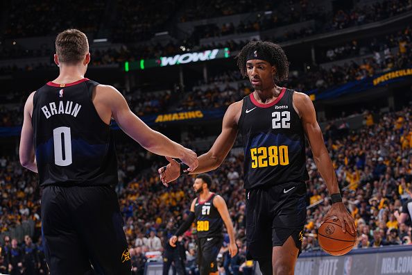 DENVER, CO - NOVEMBER 3: Christian Braun #0 high fives Zeke Nnaji #22 of the Denver Nuggets during the game against the Dallas Mavericks during the In-Season Tournament on November 3, 2023 at the Ball Arena in Denver, Colorado. NOTE TO USER: User expressly acknowledges and agrees that, by downloading and/or using this Photograph, user is consenting to the terms and conditions of the Getty Images License Agreement. Mandatory Copyright Notice: Copyright 2023 NBAE (Photo by Bart Young/NBAE via Getty Images)