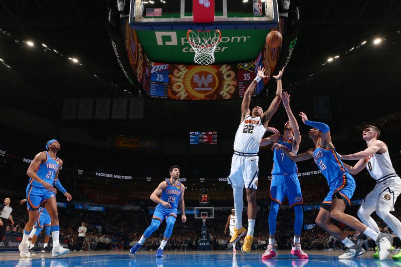 OKLAHOMA CITY, OK - JANUARY 31: Zeke Nnaji #22 of the Denver Nuggets rebounds the ball during the game against the Oklahoma City Thunder on January 31, 2024 at Paycom Arena in Oklahoma City, Oklahoma. NOTE TO USER: User expressly acknowledges and agrees that, by downloading and or using this photograph, User is consenting to the terms and conditions of the Getty Images License Agreement. Mandatory Copyright Notice: Copyright 2024 NBAE (Photo by Zach Beeker/NBAE via Getty Images)