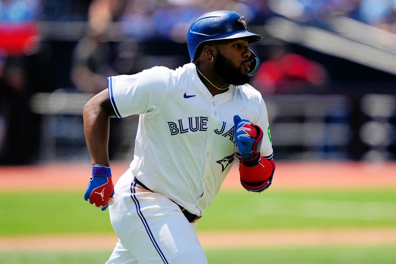 Jul 28, 2024; Toronto, Ontario, CAN; Toronto Blue Jays first baseman Vladimir Guerrero Jr. (27) runs to first base on his  solo home run against the Texas Rangers  during the third inning at Rogers Centre. Mandatory Credit: John E. Sokolowski-USA TODAY Sports