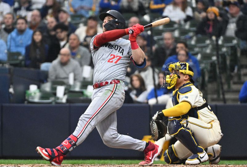 Apr 3, 2024; Milwaukee, Wisconsin, USA; Minnesota Twins catcher Ryan Jeffers (27) hits a home run against the Milwaukee Brewers in the seventh inning at American Family Field. Mandatory Credit: Michael McLoone-USA TODAY Sports