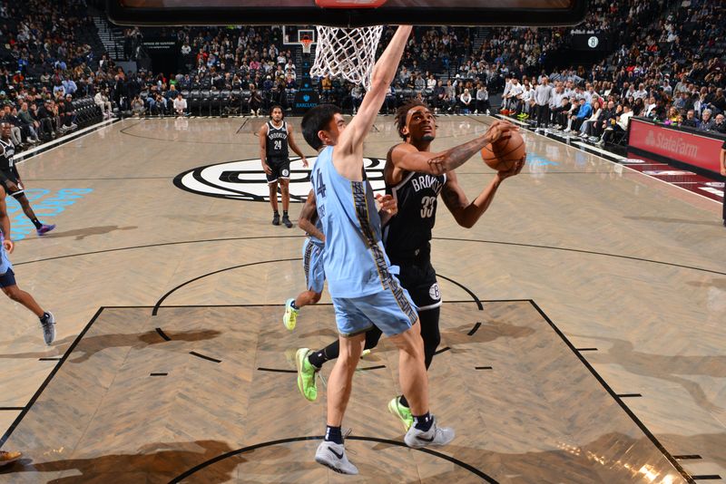 BROOKLYN, NY - NOVEMBER 4: Nicolas Claxton #33 of the Brooklyn Nets drives to the basket during the game against the Memphis Grizzlies on November 4, 2024 at Barclays Center in Brooklyn, New York. NOTE TO USER: User expressly acknowledges and agrees that, by downloading and or using this Photograph, user is consenting to the terms and conditions of the Getty Images License Agreement. Mandatory Copyright Notice: Copyright 2024 NBAE (Photo by Jesse D. Garrabrant/NBAE via Getty Images)