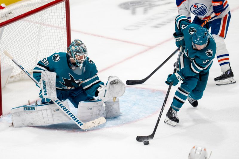 Dec 28, 2023; San Jose, California, USA; San Jose Sharks defenseman Henry Thrun (3) makes a stick save on a shot by the Edmonton Oilers during the third period at SAP Center at San Jose. Mandatory Credit: Neville E. Guard-USA TODAY Sports