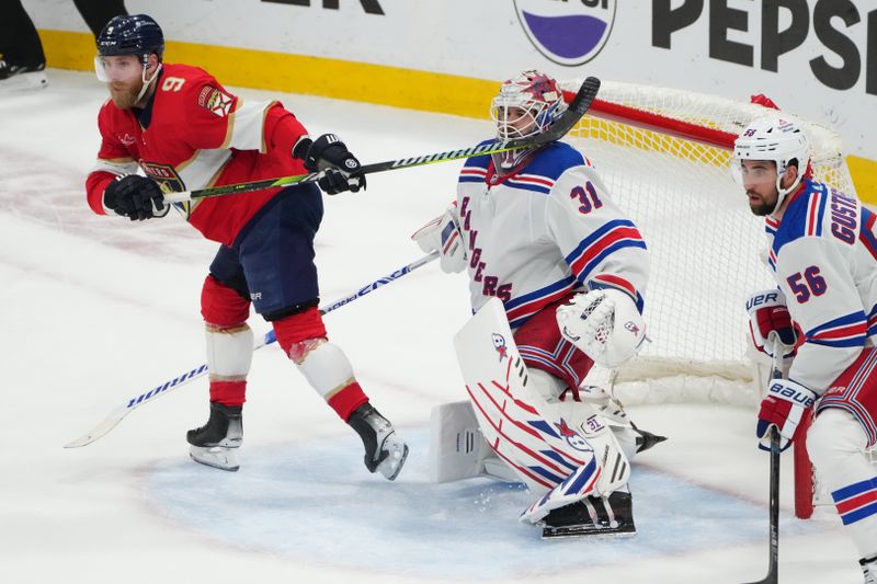 Jun 1, 2024; Sunrise, Florida, USA; The stick of Florida Panthers center Sam Bennett (9) collides with New York Rangers goaltender Igor Shesterkin (31) during the second period in game six of the Eastern Conference Final of the 2024 Stanley Cup Playoffs at Amerant Bank Arena. Mandatory Credit: Jim Rassol-USA TODAY Sports