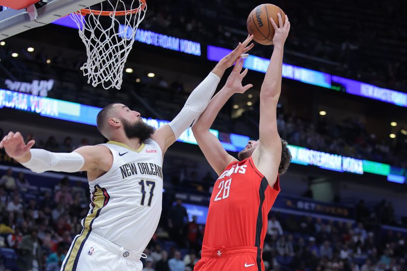 NEW ORLEANS, LOUISIANA - FEBRUARY 22: Jonas Valanciunas #17 of the New Orleans Pelicans blocks a shot from Alperen Sengun #28 of the Houston Rockets during the first half at the Smoothie King Center on February 22, 2024 in New Orleans, Louisiana. NOTE TO USER: User expressly acknowledges and agrees that, by downloading and or using this Photograph, user is consenting to the terms and conditions of the Getty Images License Agreement. (Photo by Jonathan Bachman/Getty Images)