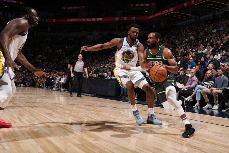 MINNEAPOLIS, MN -  MARCH 24: Mike Conley #10 of the Minnesota Timberwolves drives to the basket during the game against the Golden State Warriors on March 24, 2024 at Target Center in Minneapolis, Minnesota. NOTE TO USER: User expressly acknowledges and agrees that, by downloading and or using this Photograph, user is consenting to the terms and conditions of the Getty Images License Agreement. Mandatory Copyright Notice: Copyright 2024 NBAE (Photo by David Sherman/NBAE via Getty Images)